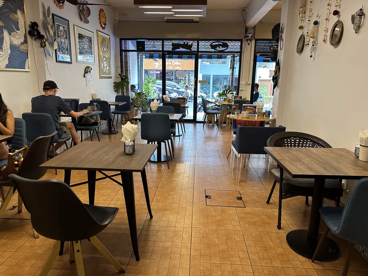 Bright, welcoming interior of Co & Caffè coffee shop with comfortable seating